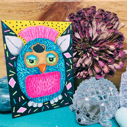 Colorful owl painting on a wooden surface with decorative elements