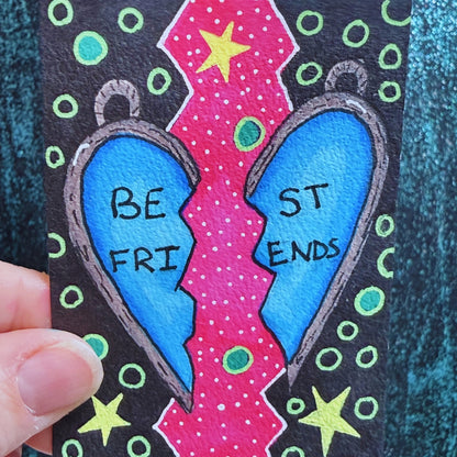 Colorful bookmark with 'BE FRI ST ENDS' text on a black background
