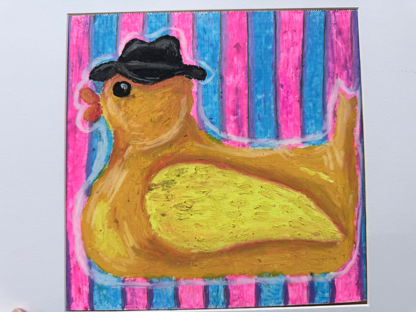 Yellow rubber duck wearing a black fedora againstpink and turquoise stripes, original oil pastel painting