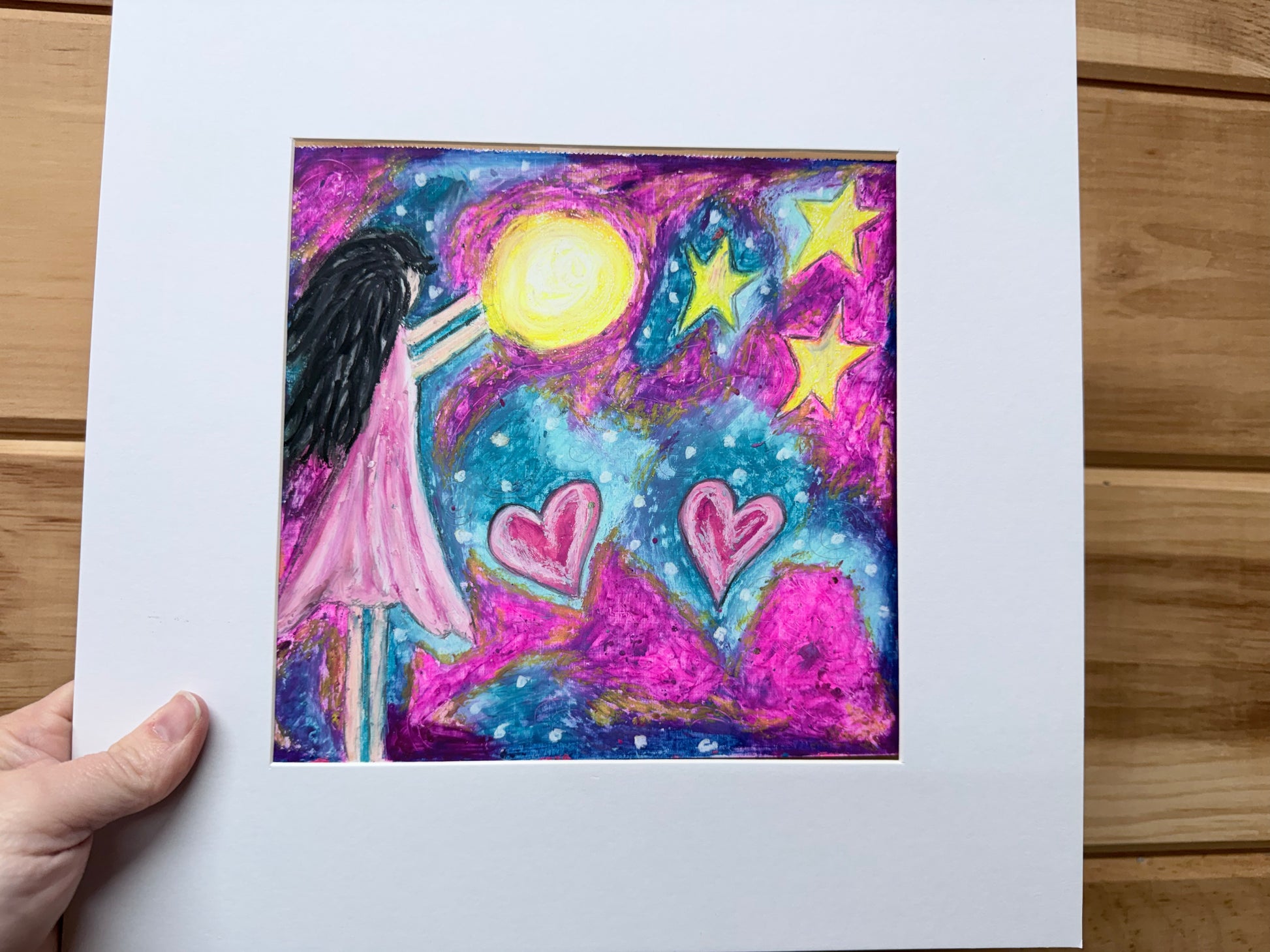 Girl in a pink dress blowing toward agolden moon with hearts and stars, original oil pastel painting."